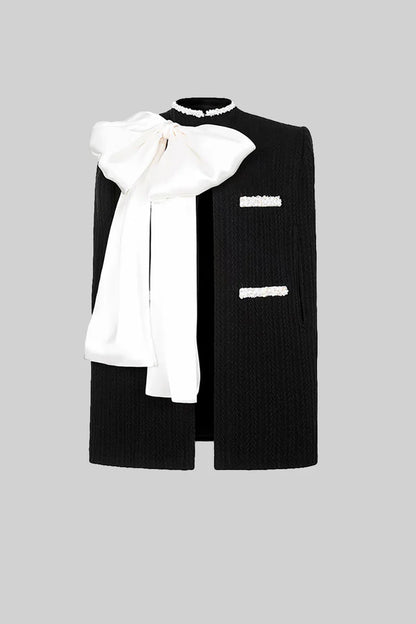 ELISA | ELEGANT TEXTURED OVERCOAT WITH WHITE BOW DETAIL - BLACK